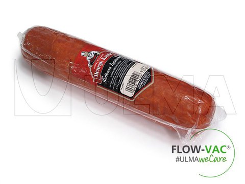 Processed meat packaging in flow vac wrapper