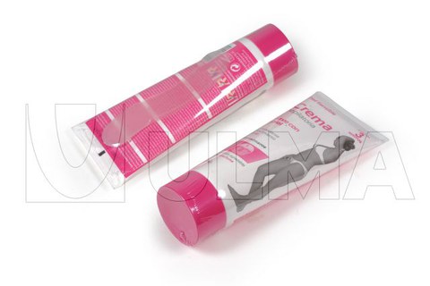 Packaging and shrinking of depilatory cream container with plastic spatula with polyolephine film